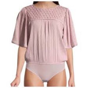 Free People Perfect Catch Bodysuit in dusty pink.